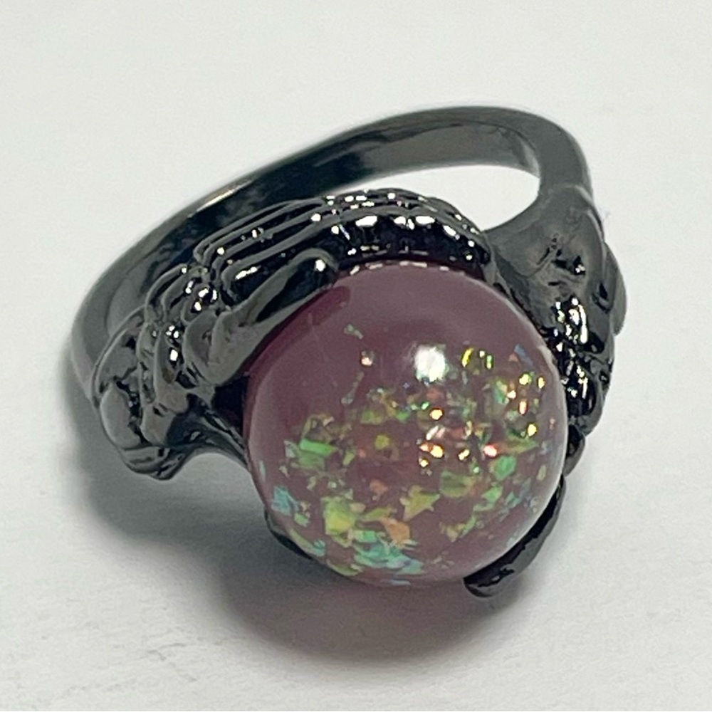 Halloween Skeleton Hands Holding a Crystal Ball Ring Charcoal Pink Glitter Bead